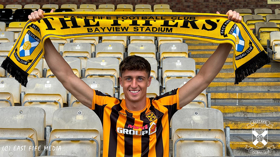 Liam Newton holding East Fife scarf